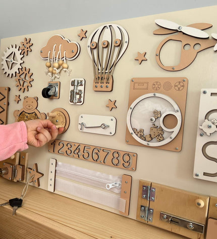 Montessori busy board with doors and locks (40×60 cm)